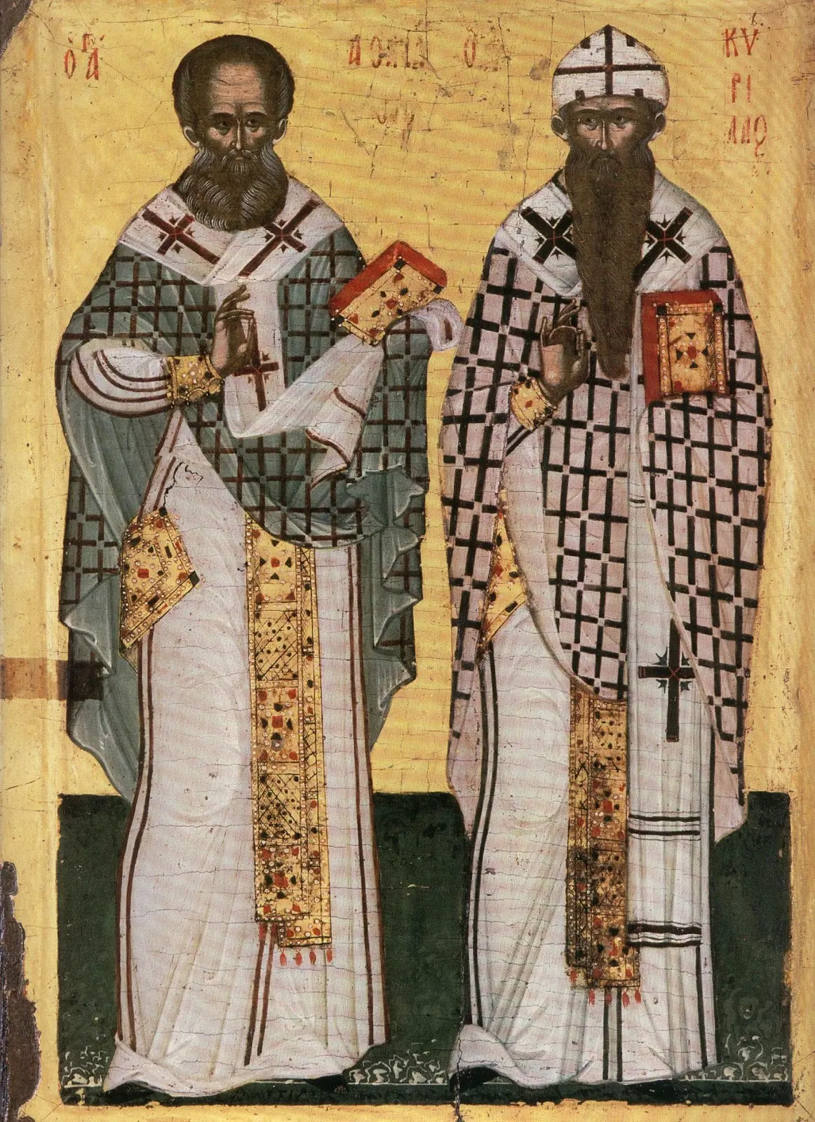 A gold-ground icon of two bishops in patterned vestments, each holding a Gospel book.