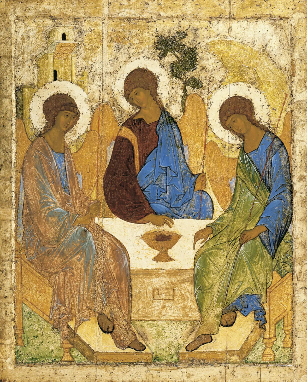 An icon of three angels seated around a table, each with a staff, inclining towards one another.