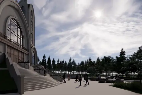 A rendering looking up at one of the church towers and the edge of the great arch, framed by a tree.