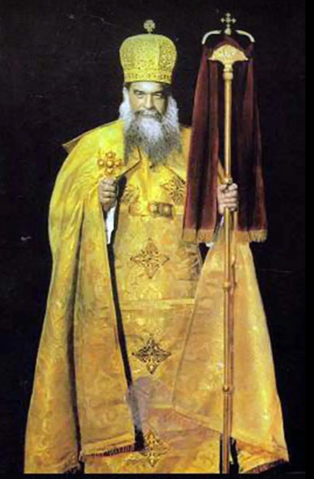 A portrait of Pope Kyrillos VI in a dark embroidered vestment and domed headdress, holding a pastoral staff.